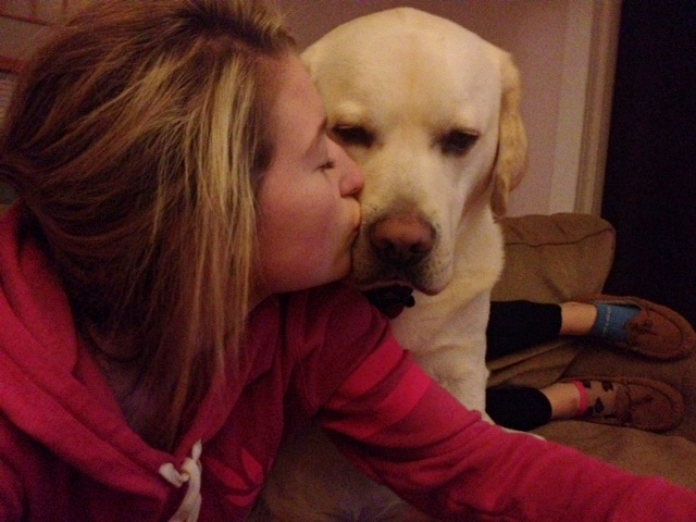 Tucker and Jessica share a tender kiss on the snout.